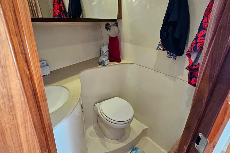 Slide: The Image of Compact bathroom in 2009 Cobalt 373 boat with toilet and sink. - 44