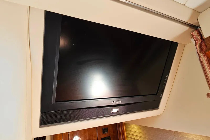 Slide: The Image of Flat-screen TV in 2009 Cobalt 373 boat interior, mounted on beige wall. - 49