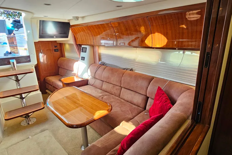 Slide: The Image of Luxurious interior of a 2009 Cobalt 373 yacht with plush seating and wooden accents. - 51