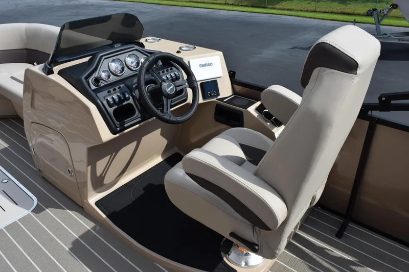 Slide: The Image of 2026 Bentley Pontoons Legacy 223 Cruise XL helm with modern controls and comfortable seating. - 11