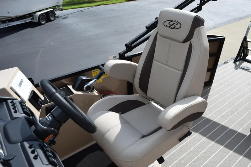 Slide: The Image of Captain's chair in 2026 Bentley Pontoons Legacy 223 Cruise XL boat cockpit. - 12