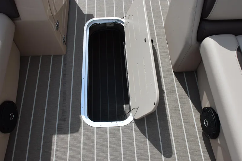 Slide: The Image of Open storage compartment on 2026 Bentley Pontoons Legacy 223 Cruise XL boat deck. - 15