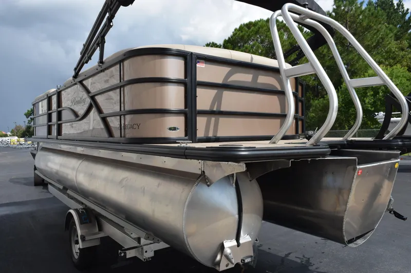 Slide: The Image of 2026 Bentley Pontoons Legacy 223 Cruise XL pontoon boat on trailer, side view. - 6