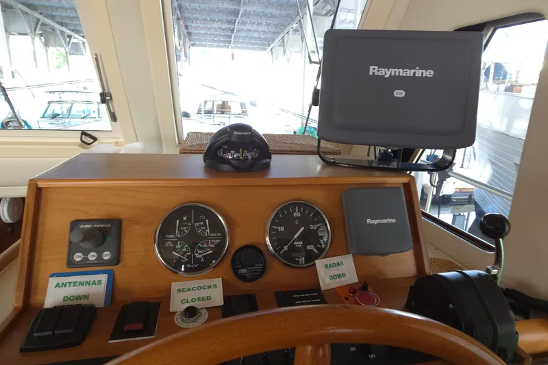 Slide: The Image of helm with Raymarine E80 display and navigation controls - 27