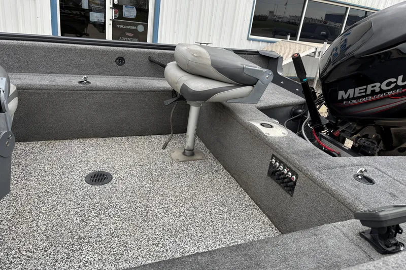 Slide: The Image of 2015 Tracker Pro Guide V-16 T boat interior with Mercury engine and seating. - 11