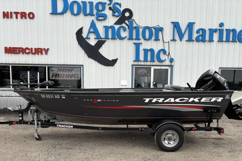 Slide: The Image of 2015 Tracker Pro Guide V-16 T boat on trailer at Doug's Anchor Marine. - 14