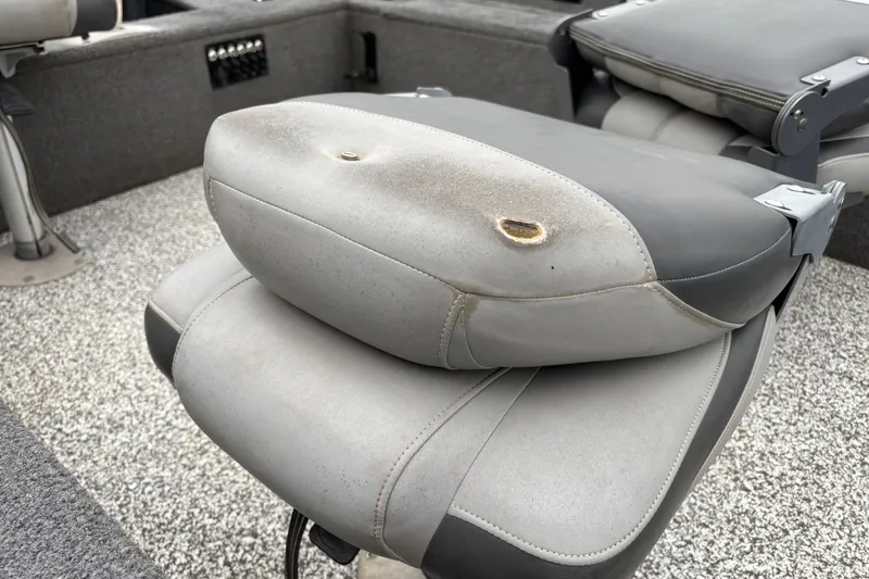 Slide: The Image of Worn seat on 2015 Tracker Pro Guide V-16 T boat, showing visible damage. - 7