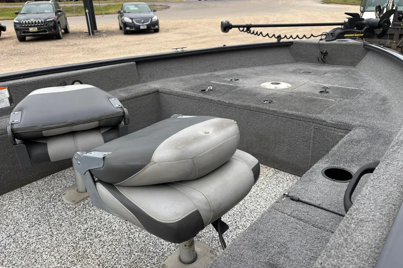 Slide: The Image of 2015 Tracker Pro Guide V-16 T boat interior with seating and fishing deck. - 9