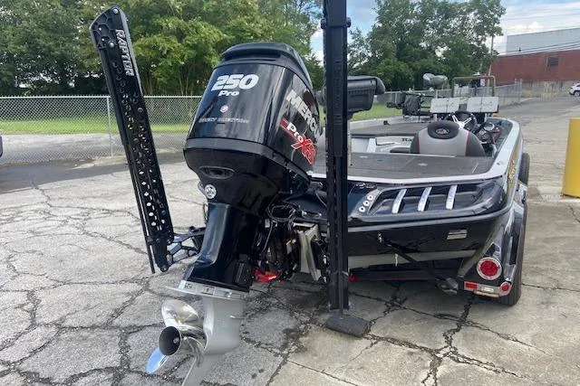 Slide: The Image of 2014 Ranger 520C boat with Mercury 250 Pro XS engine, parked outdoors. - 3