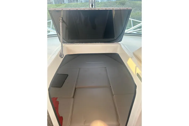 Slide: The Image of 2004 Parker 2510 Modified Vee Walkaround cabin interior with open hatch. - 6