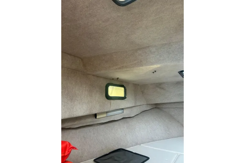 Slide: The Image of Interior cabin of 2004 Parker 2510 Modified Vee Walkaround boat, featuring compact design. - 8