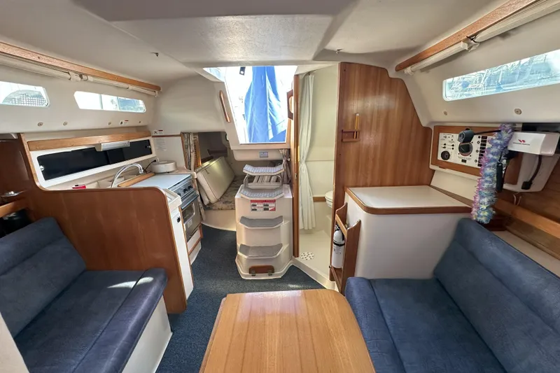 Slide: The Image of Interior of 2001 Catalina 28 MkII sailboat with cozy seating and compact kitchen. - 15