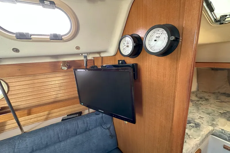 Slide: The Image of Interior of 2001 Catalina 28 MkII sailboat with TV and gauges on wooden wall. - 21