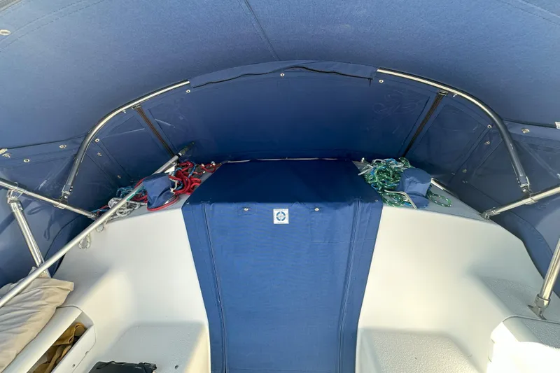 Slide: The Image of Interior view of a 2001 Catalina 28 MkII sailboat with blue canopy and ropes. - 27
