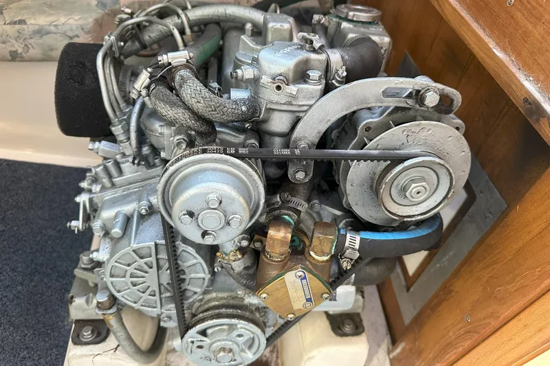 Slide: The Image of Engine of a 2001 Catalina 28 MkII sailboat, showcasing mechanical components. - 28
