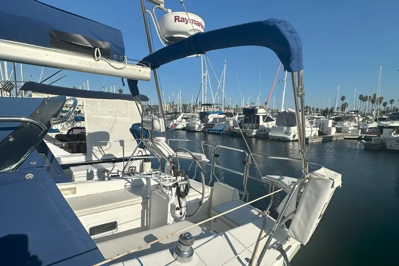 Slide: The Image of 2001 Catalina 28 MkII sailboat docked in a marina under clear blue skies. - 9