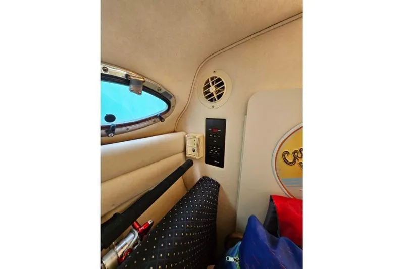 Slide: The Image of Interior of 2001 Sea Ray 260 Sundancer boat with window and control panel. - 16