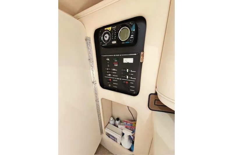 Slide: The Image of Control panel of a 2001 Sea Ray 260 Sundancer boat interior. - 27