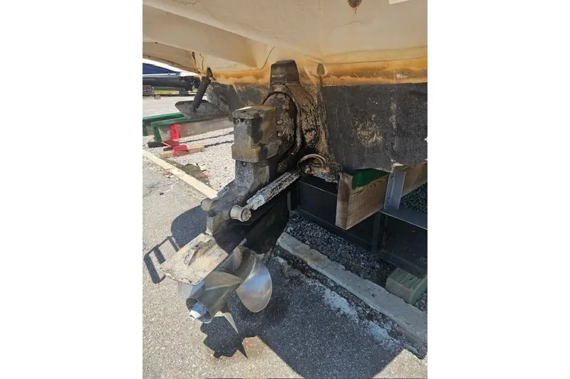 Slide: The Image of 2001 Sea Ray 260 Sundancer boat propeller and stern drive detail. - 8