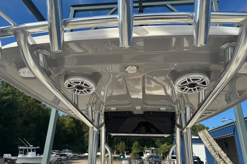 Slide: The Image of 2026 Bulls Bay 255 boat T-top with speakers and stainless steel frame. - 10