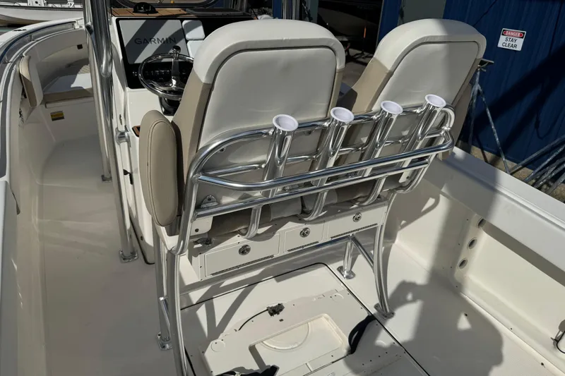 Slide: The Image of 2026 Bulls Bay 255 boat interior with rod holders and seating. - 6