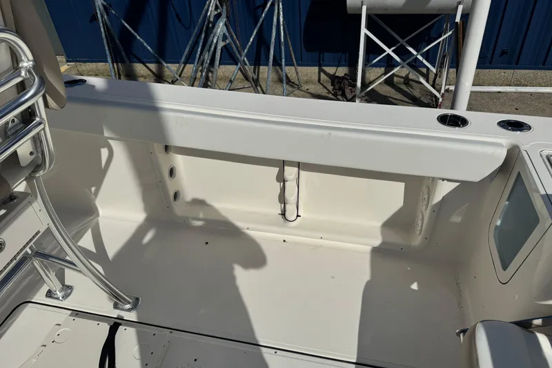 Slide: The Image of 2026 Bulls Bay 255 boat interior with seating and storage compartments. - 7