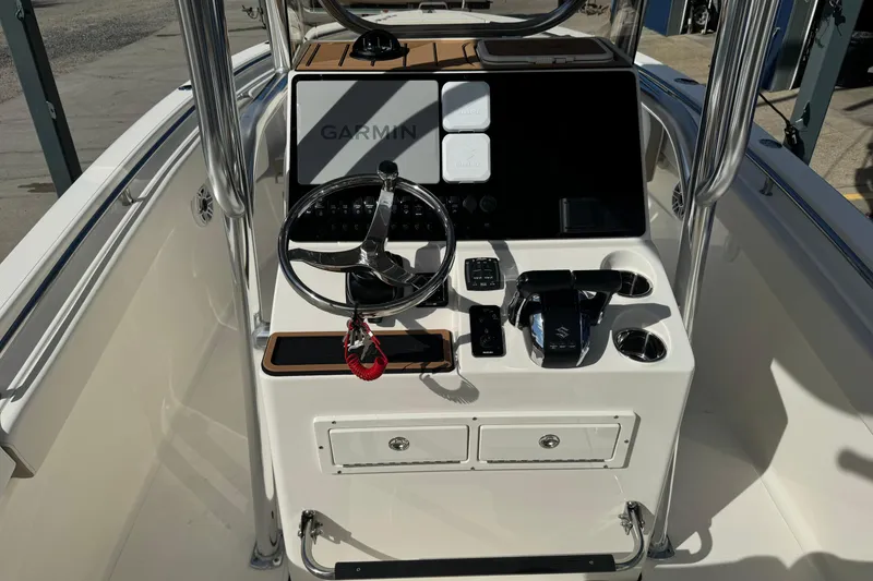 Slide: The Image of 2026 Bulls Bay 255 boat console with Garmin navigation and steering wheel. - 8
