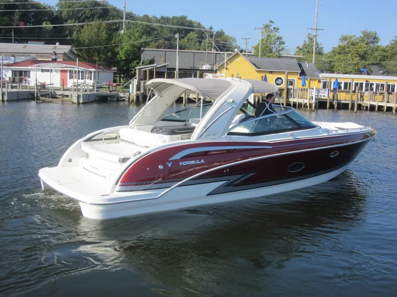 Slide: The Image of 2019 Formula 350 Crossover Bowrider in a marina. - 2