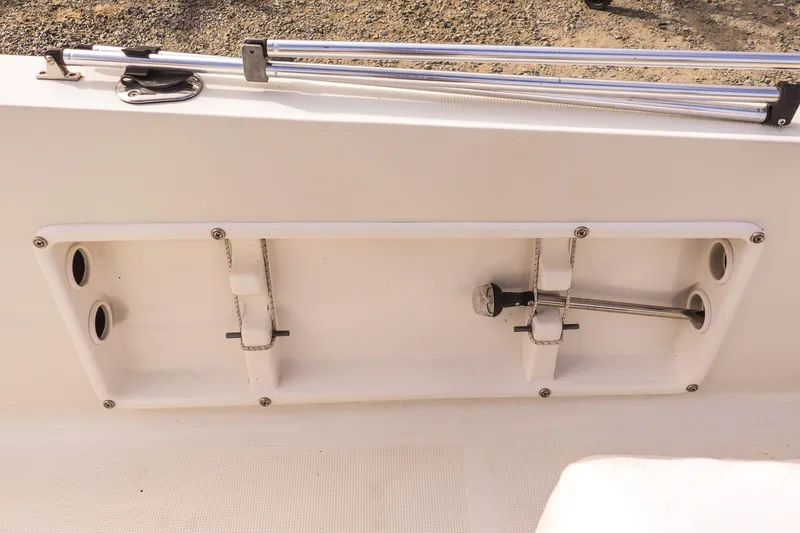 Slide: The Image of Key Largo 1800 Center Console 2020 boat detail showing rod holders and cleats. - 12