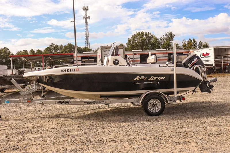 Slide: The Image of 2020 Key Largo 1800 Center Console boat on trailer, parked outdoors. - 3