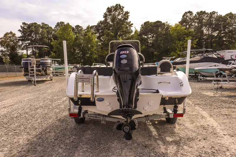 Slide: The Image of 2020 Key Largo 1800 Center Console boat with outboard motor on a trailer. - 5