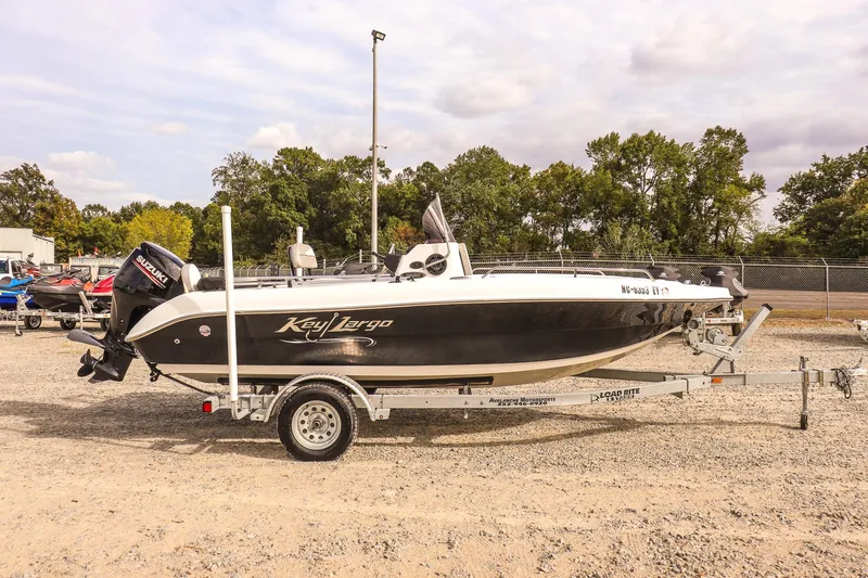 Slide: The Image of 2020 Key Largo 1800 Center Console boat on trailer, parked outdoors. - 7