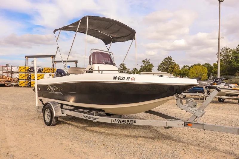Slide: The Image of 2020 Key Largo 1800 Center Console boat on trailer, parked outdoors. - 8