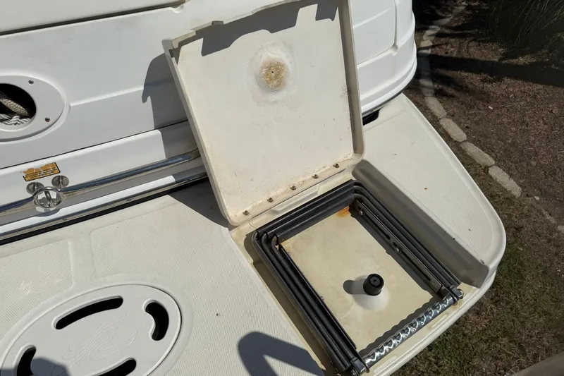 Slide: The Image of 2006 Sea Ray 270 Amberjack swim platform with foldable ladder and storage compartment. - 11