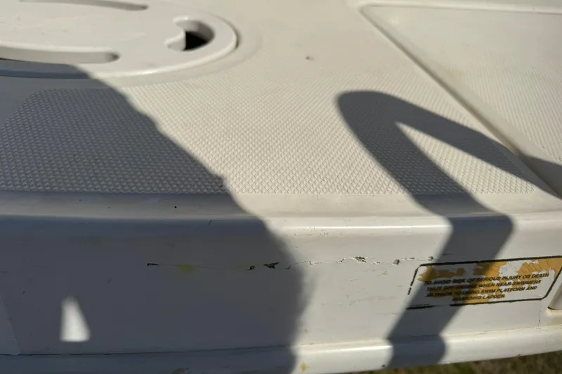 Slide: The Image of Cracked surface on 2006 Sea Ray 270 Amberjack boat deck with shadow. - 12