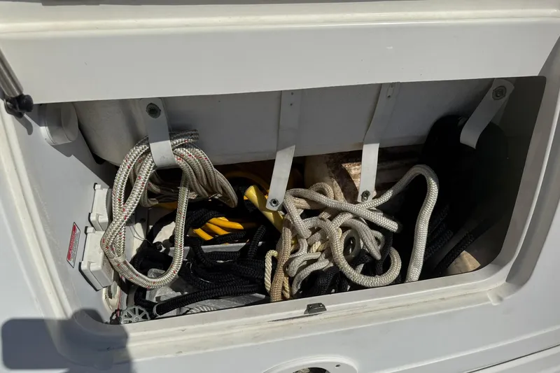 Slide: The Image of Storage compartment with ropes on a 2006 Sea Ray 270 Amberjack boat. - 13
