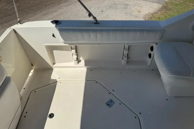 Slide: The Image of 2006 Sea Ray 270 Amberjack boat interior with seating and storage compartments. - 15