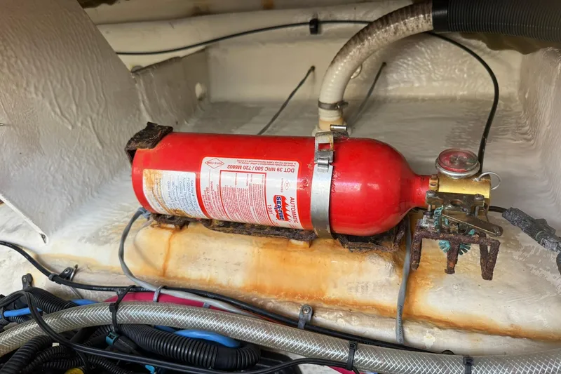 Slide: The Image of Fire extinguisher in 2006 Sea Ray 270 Amberjack boat engine compartment. - 21