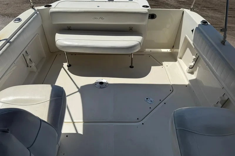 Slide: The Image of 2006 Sea Ray 270 Amberjack boat interior with white seating and spacious deck. - 22
