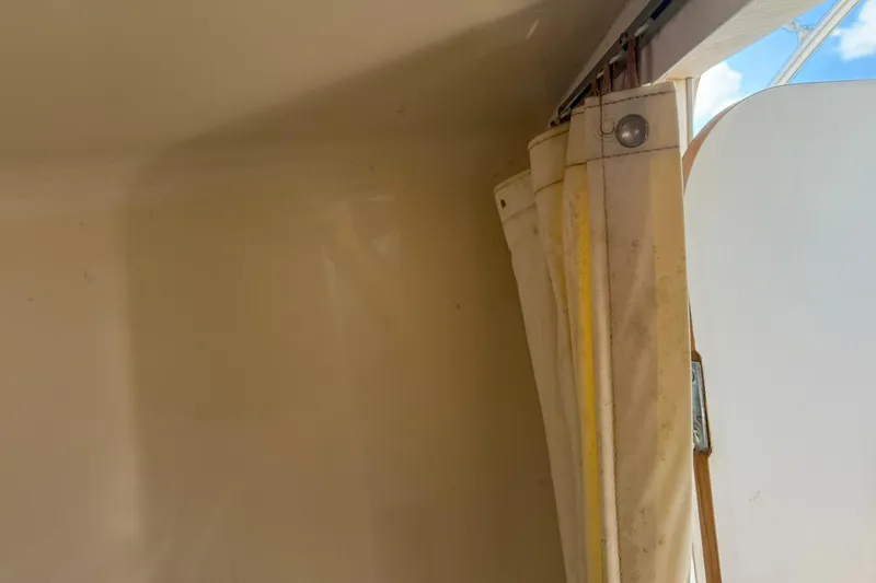 Slide: The Image of Interior view of 2006 Sea Ray 270 Amberjack boat with curtain detail. - 29