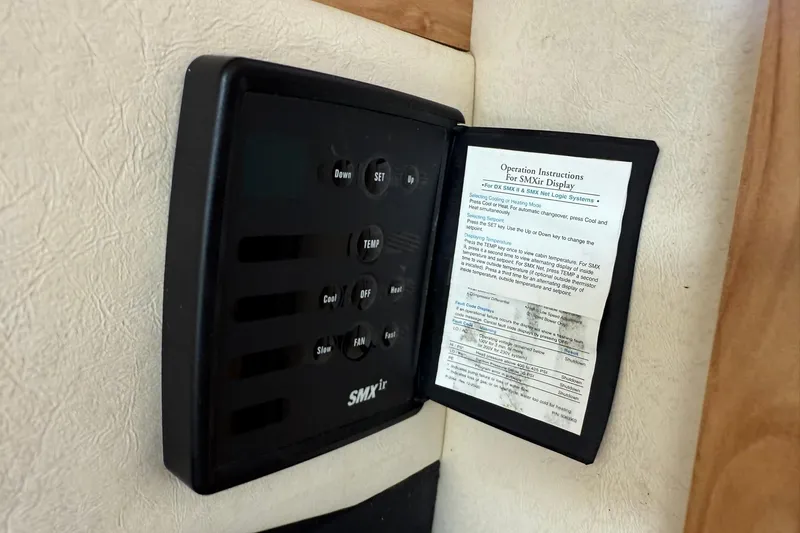 Slide: The Image of SMXir control panel with instructions, Sea Ray 270 Amberjack 2006 boat interior. - 33