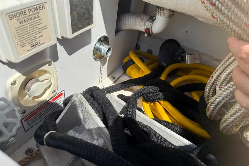Slide: The Image of Electrical and rope storage area on a 2006 Sea Ray 270 Amberjack boat. - 43