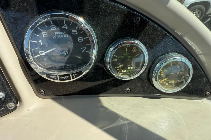 Slide: The Image of Dashboard gauges of a 2006 Sea Ray 270 Amberjack boat. - 51