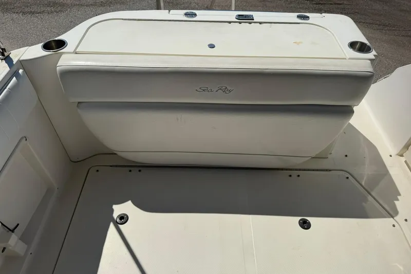 Slide: The Image of 2006 Sea Ray 270 Amberjack boat interior with white seating and cup holders. - 6