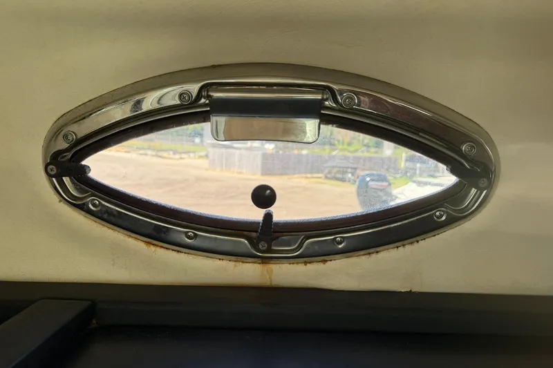 Slide: The Image of Oval window on 2006 Sea Ray 270 Amberjack boat interior. - 62