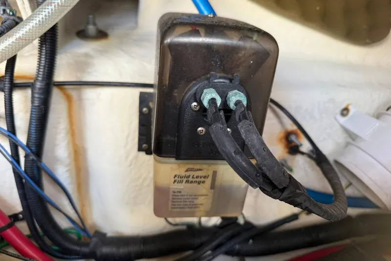 Slide: The Image of 2006 Sea Ray 270 Amberjack fluid level sensor with connected wires in engine compartment. - 66