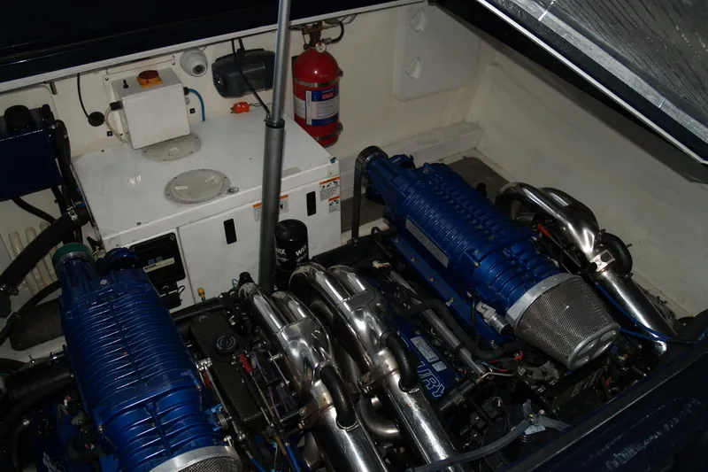 Slide: The Image of Engine compartment of 2012 Hunton XRS 43 with dual blue supercharged engines. - 11
