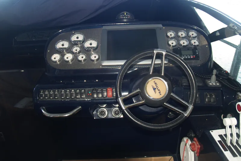 Slide: The Image of Cockpit of 2012 Hunton XRS 43 with steering wheel and control panel. - 2