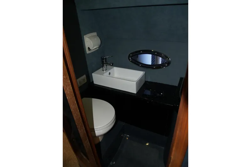 Slide: The Image of Compact bathroom in 2012 Hunton XRS 43 yacht with sink and toilet. - 8