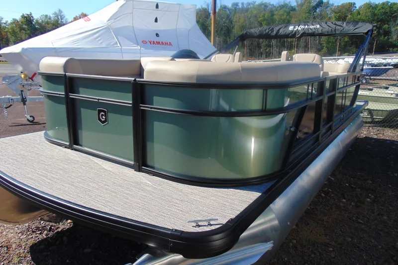 The Image of 2026 Godfrey Xperience 2086SBX pontoon boat with beige seating and green exterior. - 1